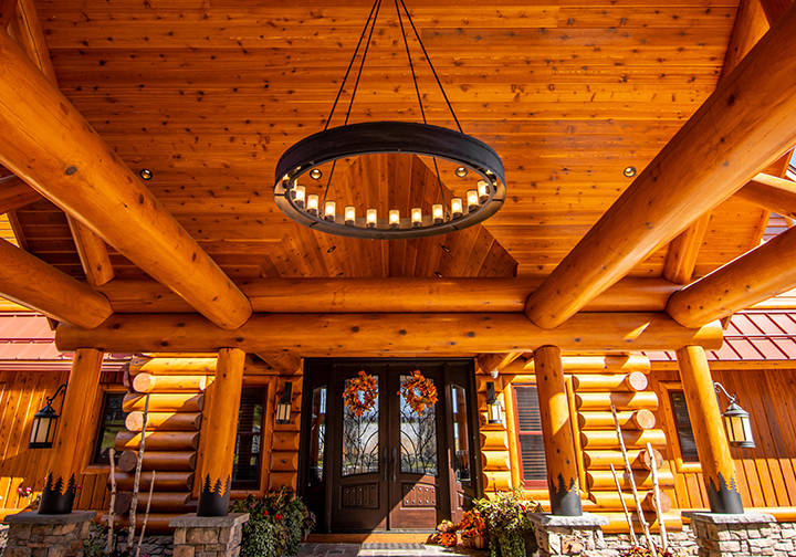 Loxley Escabroso custom outdoor chandelier installed in resort entrance patio